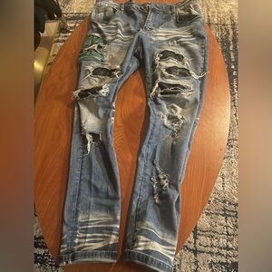 AMIRI Blue Distressed Skinny Jeans